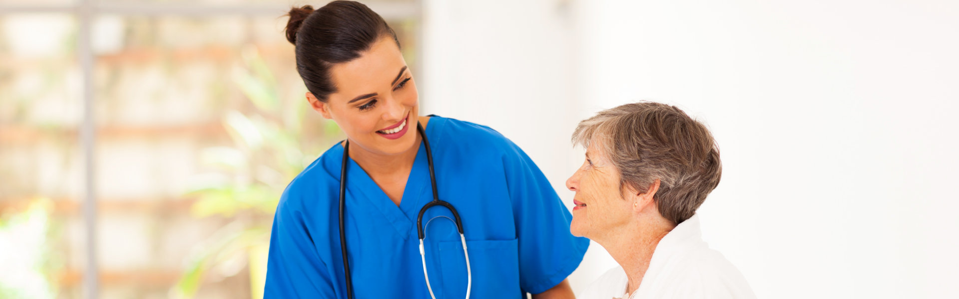 a nurse and an elder talking