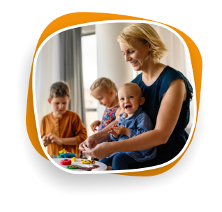 woman holding infant with other kids