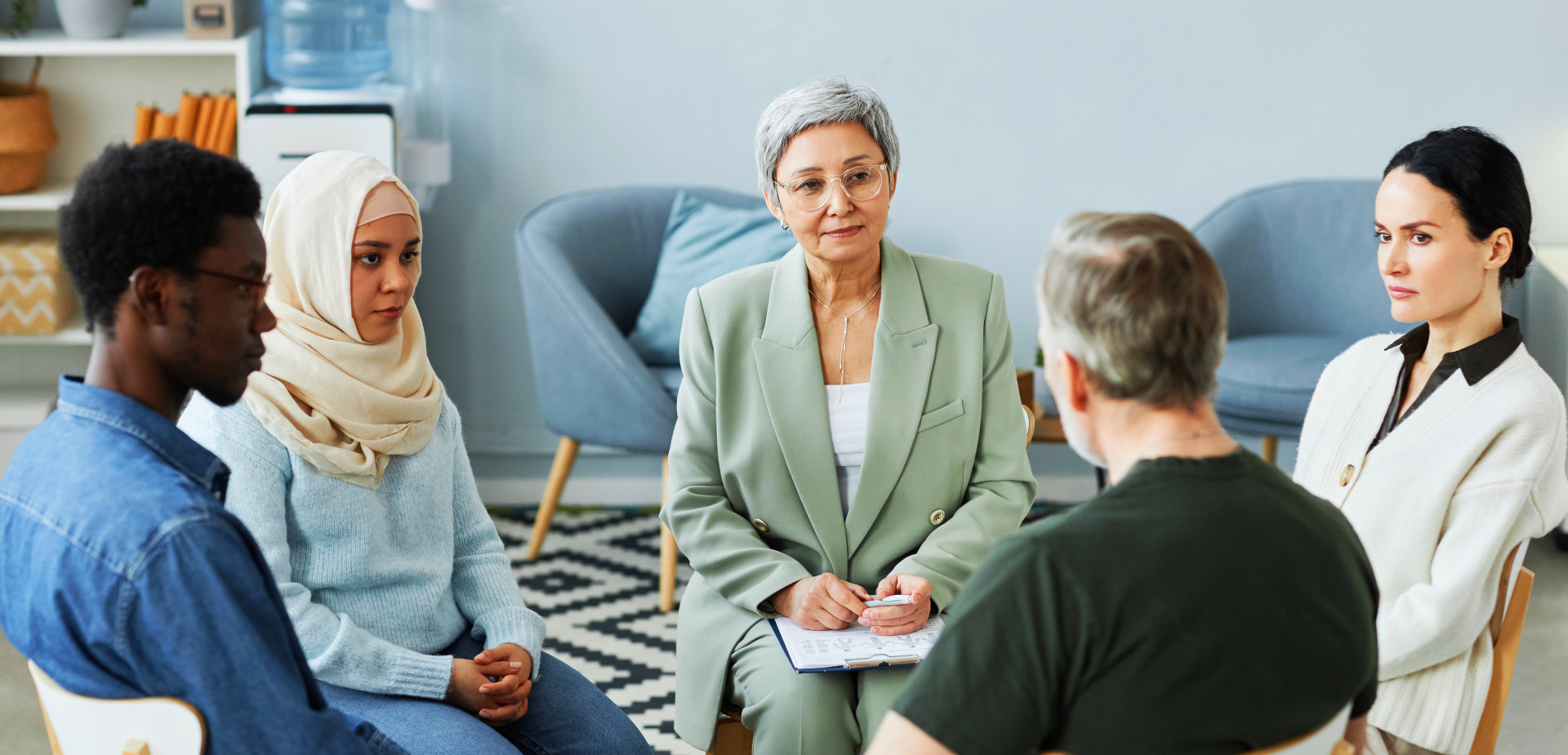 psychiatrist and group of patient having a counseling