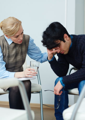 psychiatrist comforting the patient