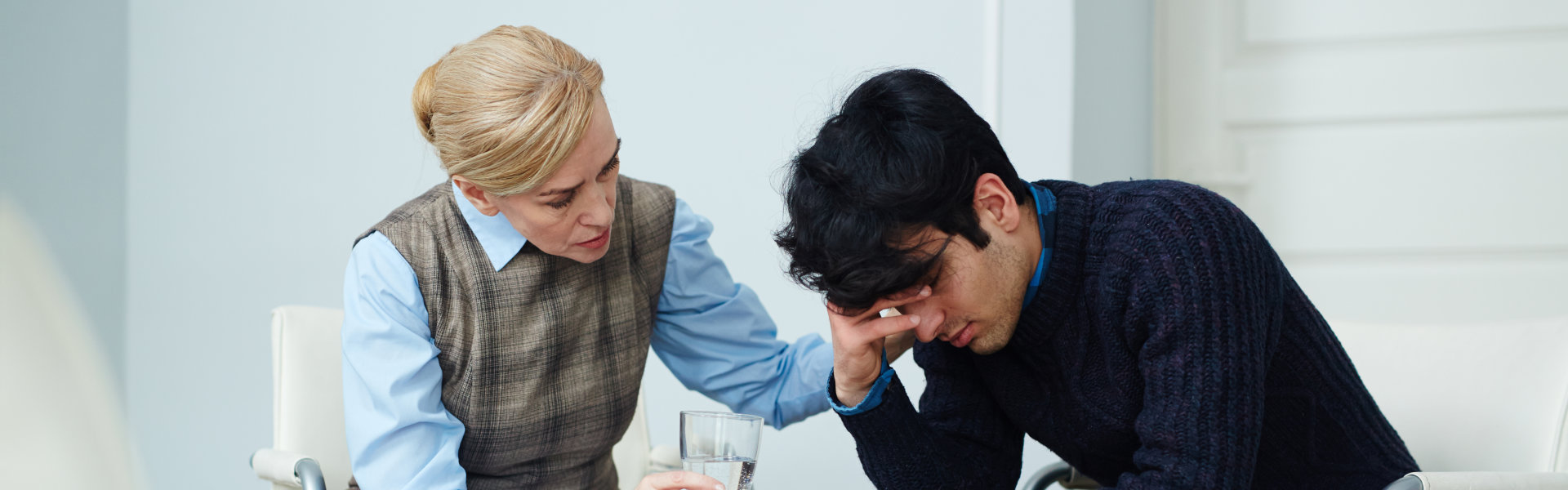 psychiatrist comforting the patient