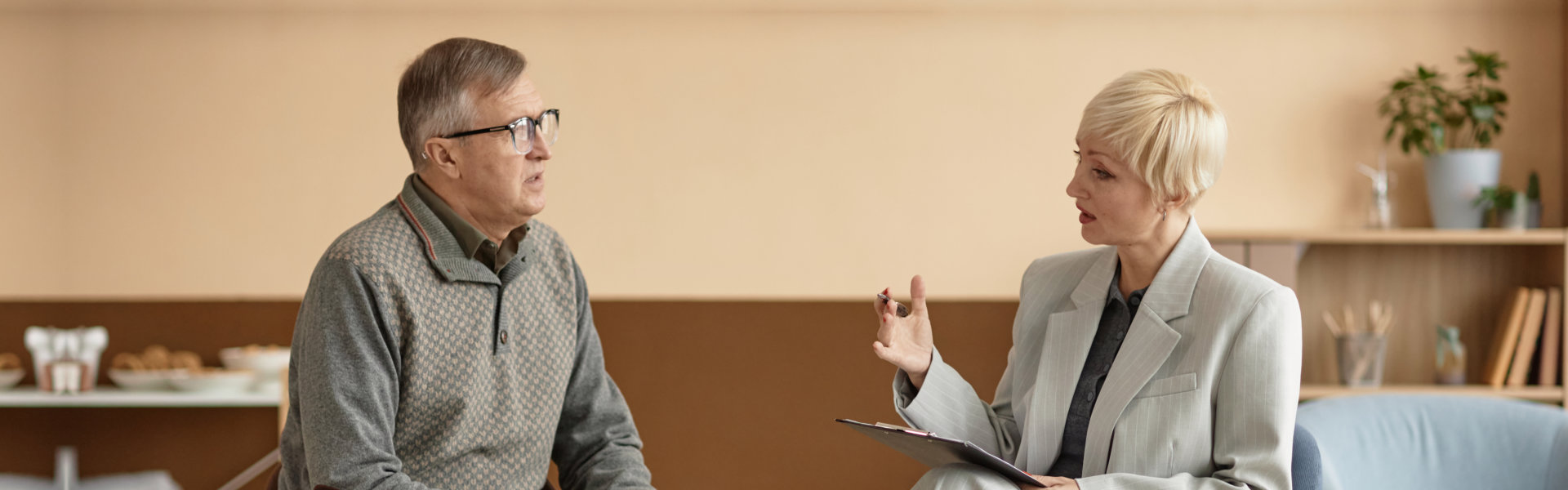 psychiatrist and senior man patient having a conversation