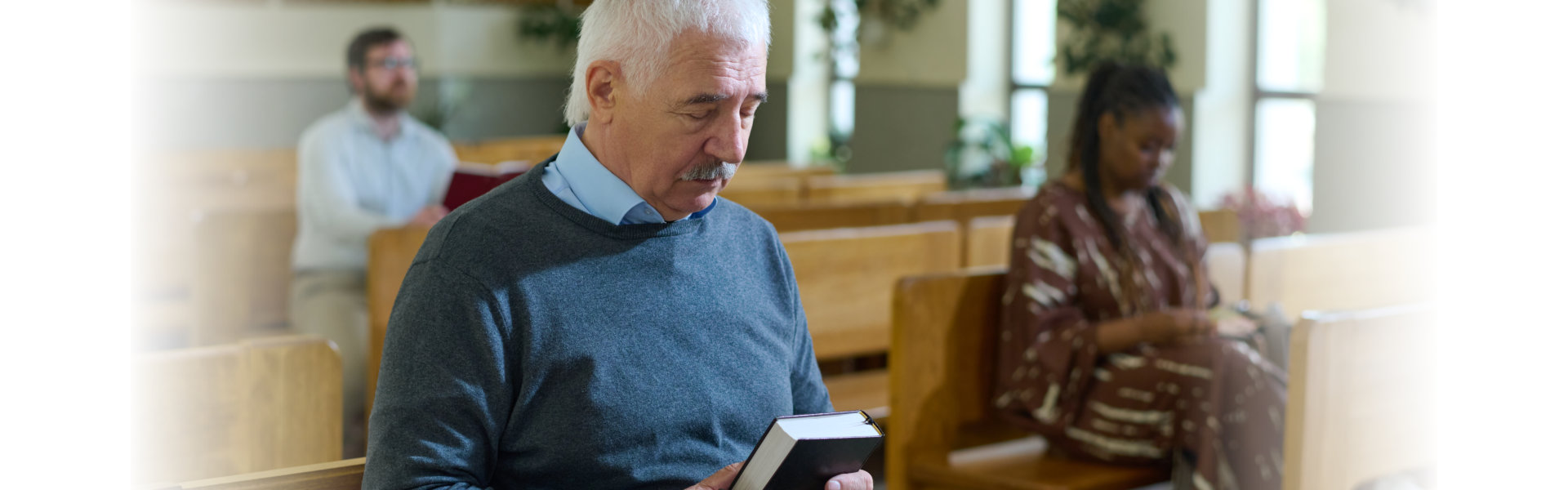 a man holding a bible