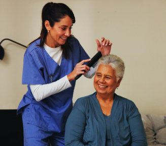 caregiver assist the elderly woman