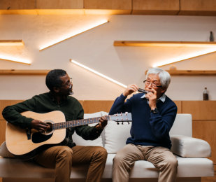 two person playing guitar and whistle