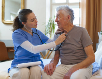 caregiver and elderly man