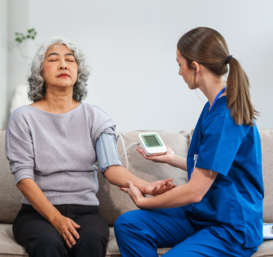 female doctor checks health with blood pressure monitoring