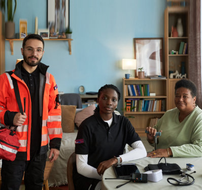 Portrait of Senior Woman with Diverse Paramedics at Home