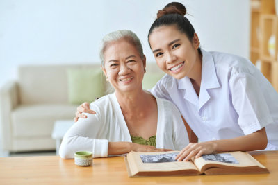 elderly and caregiver smiling