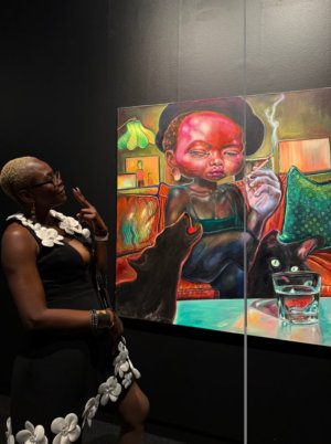 a woman looking at painting