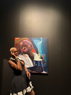 a woman looking at painting