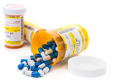 prescription medication cascading out of pharmacy vials