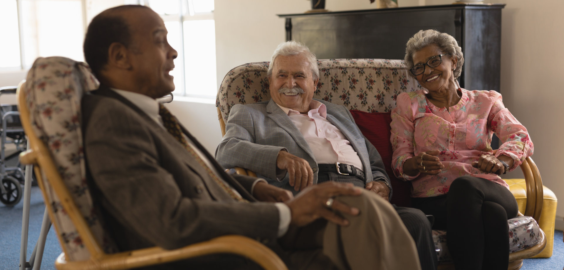 man and senior people having a conversation