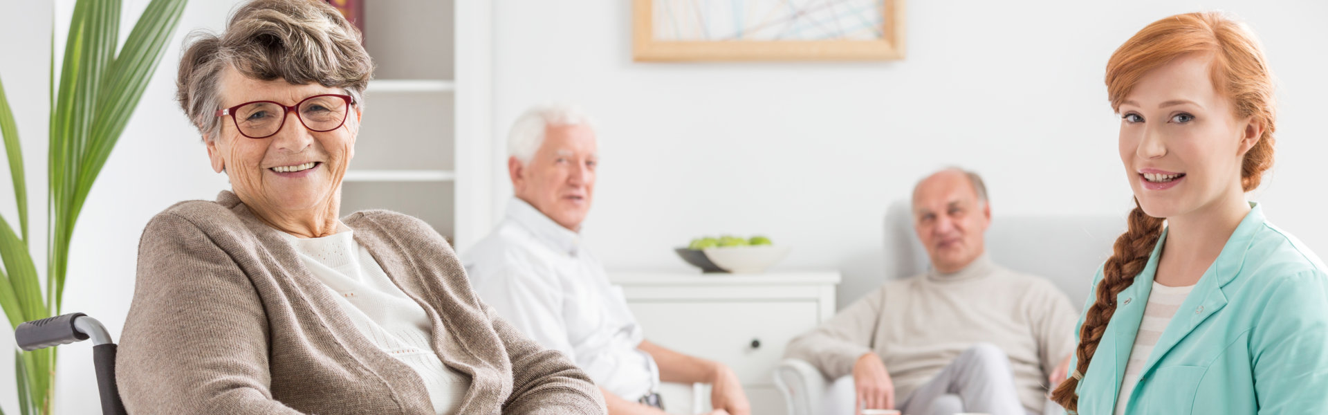 aide and senior woman smiling