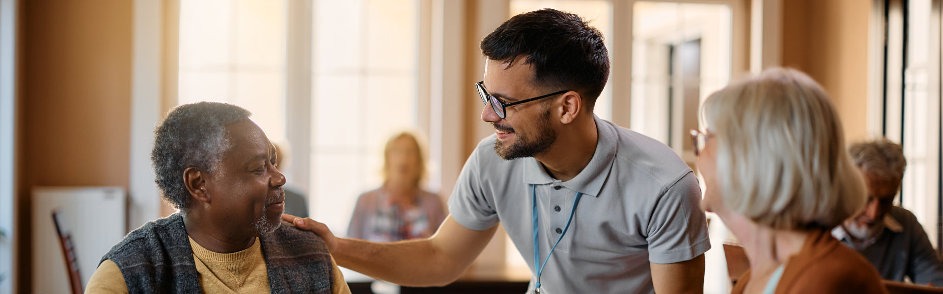 aide smiling at the senior man