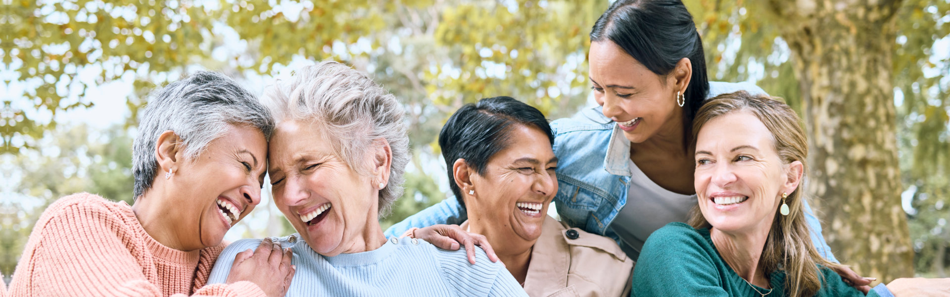 aide and senior people laughing together