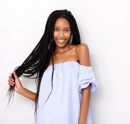 woman with braided hair smiling