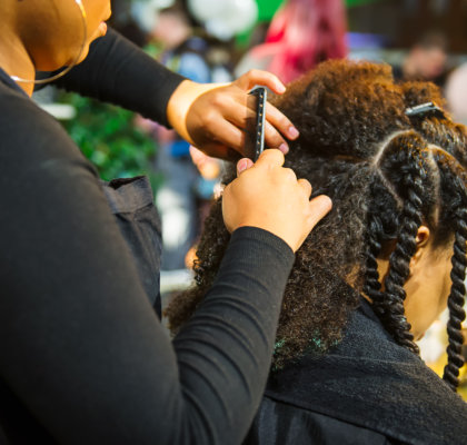hairstylist braided hair of woman