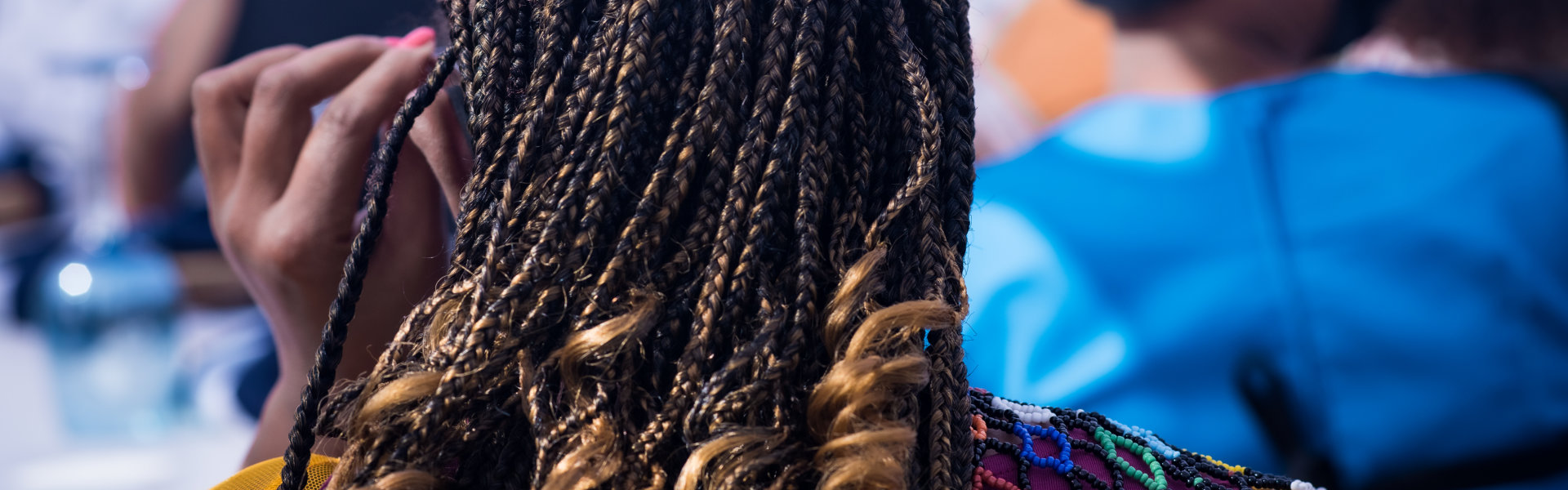 Rear view of woman with braids