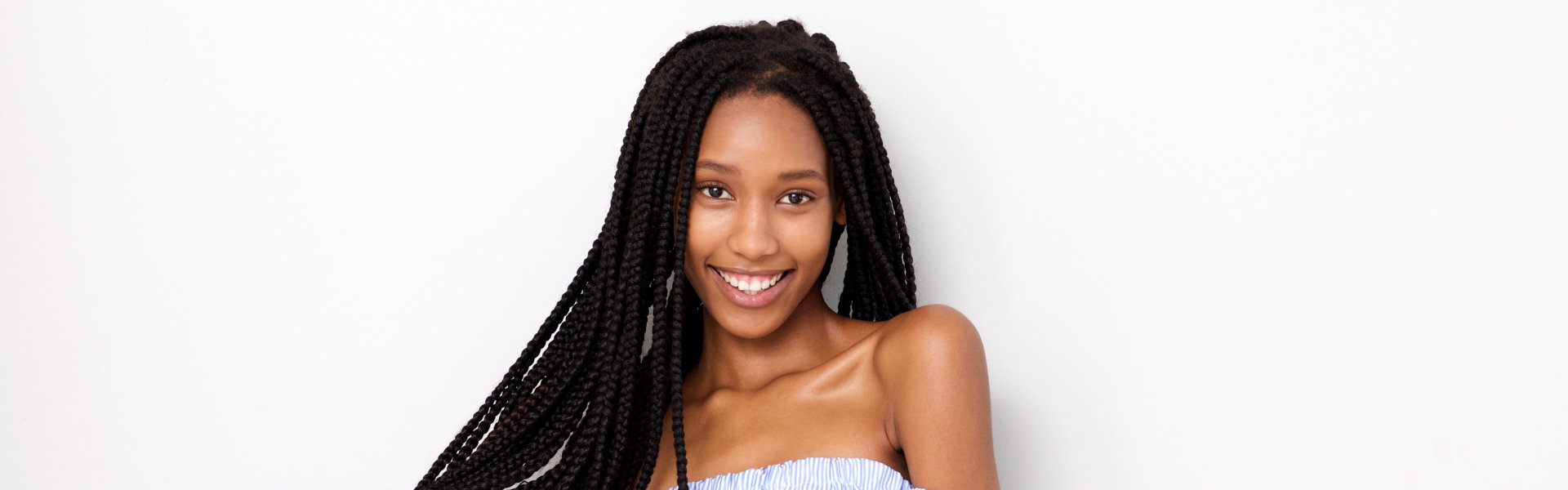 woman with braided hair smiling