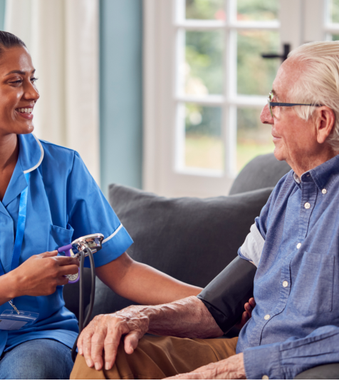 caregiver talking to old man