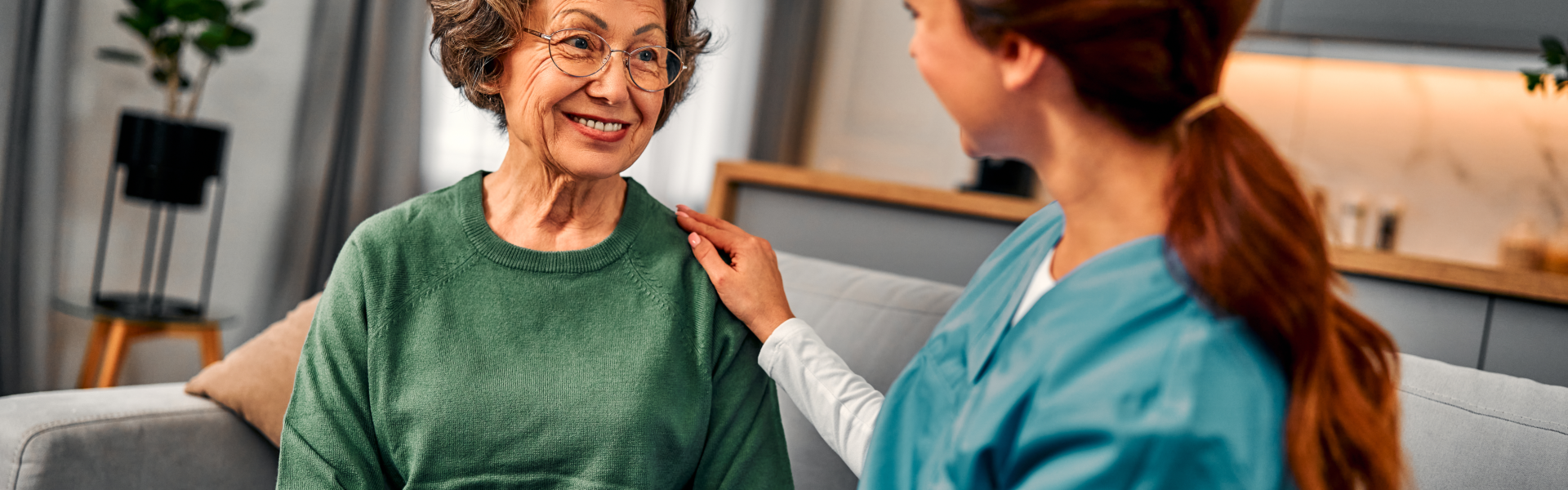 elder woman happy with caregiver